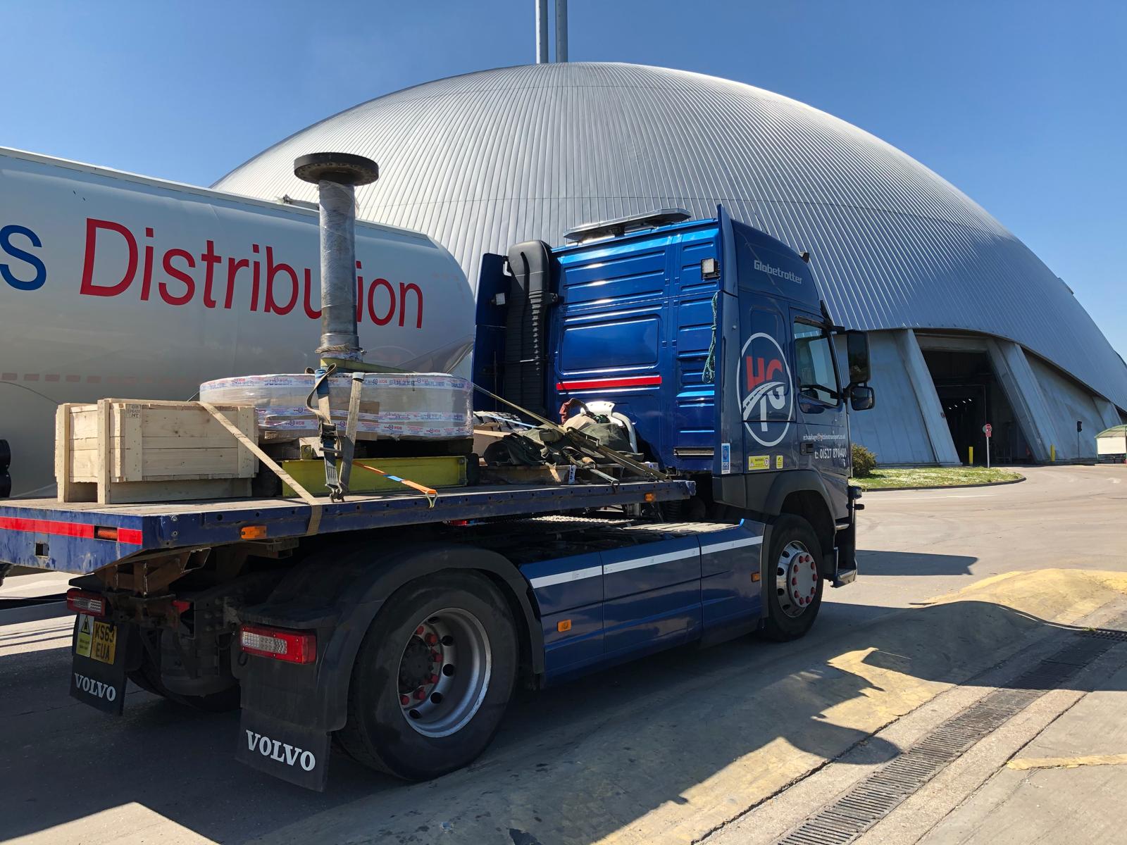 Machinery loaded and secured for transport